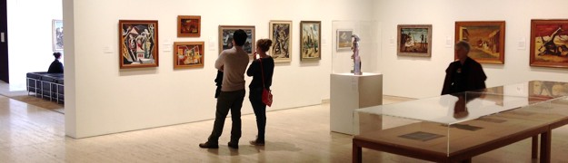 people looking at art